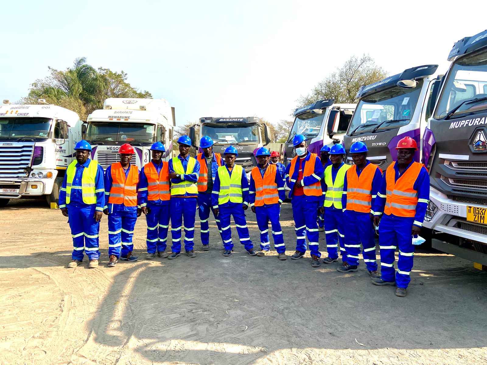 Barapate operations team standing with the company fleet